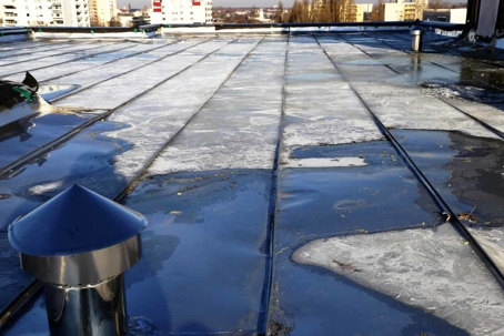 melted ice on commercial roof