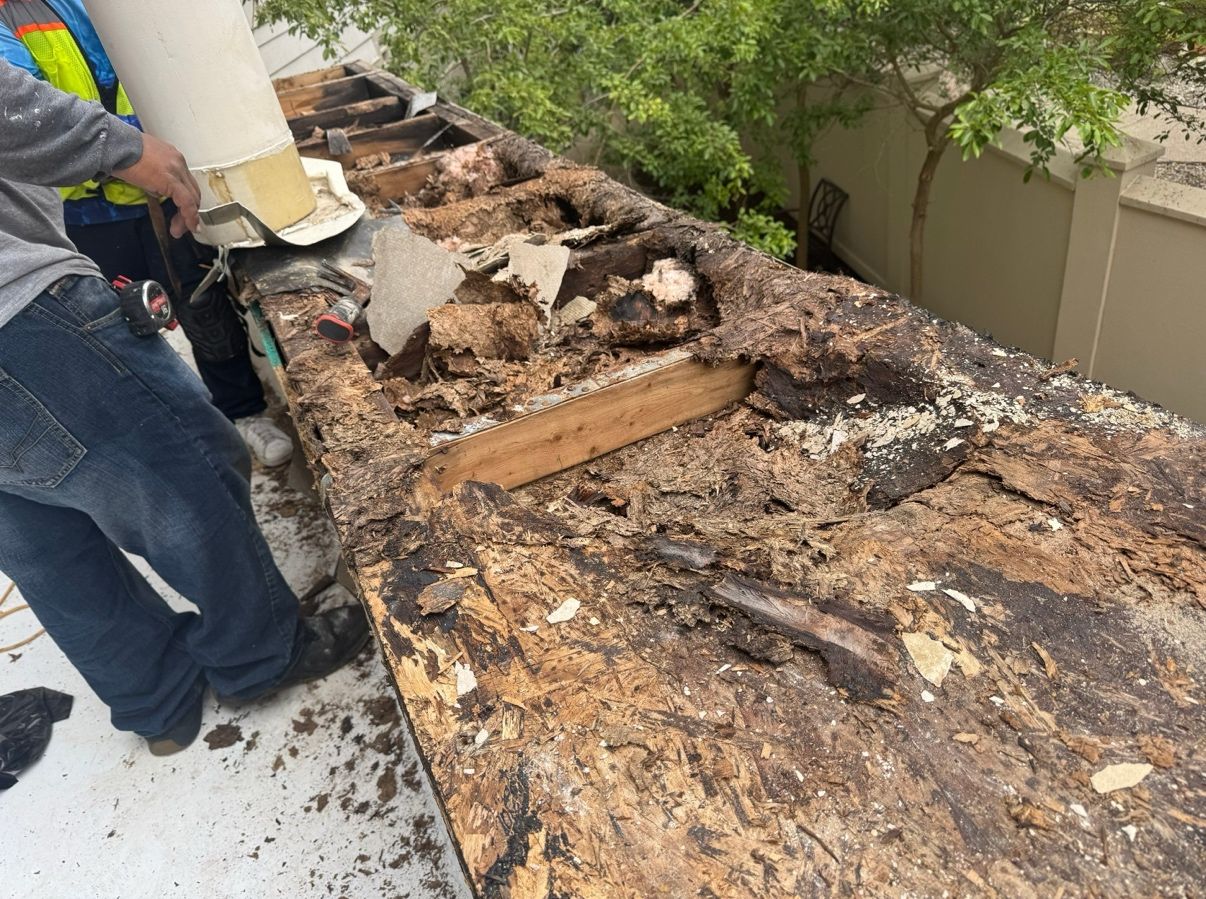 man repairing damaged roof